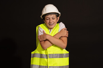 a teenager in a helmet and a vest stands frozen.