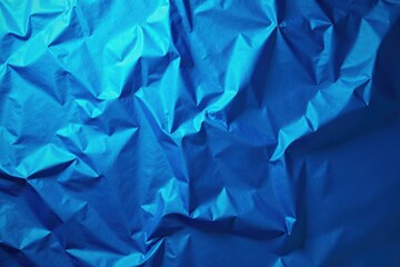 Obraz premium Deep blue foil backdrop, crumpled effect, highlights, background texture, elegant