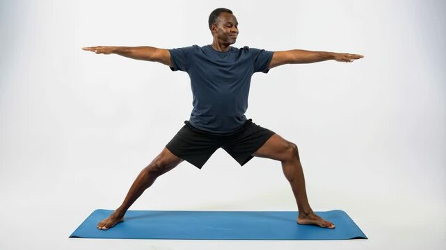 African American man doing yoga over white background