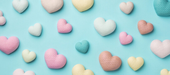 Colorful tiny hearts on pastel blue background. Minimal concept idea.