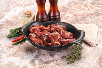 Raw uncokked chicken liver in the bowl