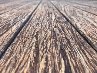 Detailed close-up of aged wood with selective focus, highlighting grooves and natural texture. Great for visual compositions, interior design, and rustic concepts.