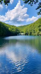 Fototapeta premium Beautiful nature landscape with a blue lake and green forest, with picturesque waterfalls 