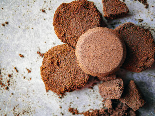 Top view of coffee grounds from espresso machine. coffee ground on gray background