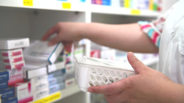 Pharmacist filling prescription in pharmacy drugstore