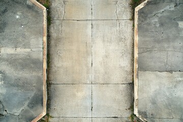 Symmetrical weathered concrete sidewalk pattern. AI generated