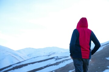 Naklejka premium young man in the mountains