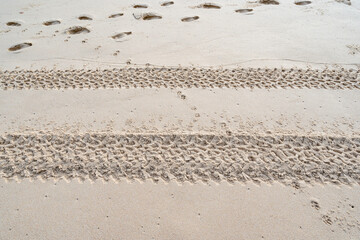 4x4 tyre tracks crisscrossing Tire tracks on the sand texture background