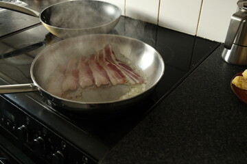 cooking meat in a pan