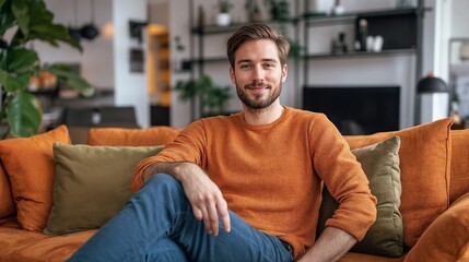 Fototapeta premium Content creator relaxing on comfortable couch in modern living space. Ideal for remote work lifestyle, home office, and contemporary living
