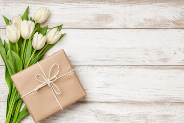 Fototapeta premium Minimalist natural-style present with soft floral composition on a textured background