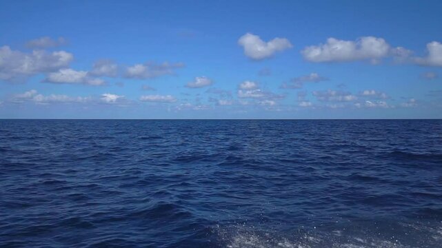 big sailing yacht boat driving thru the ocean on a sunny day