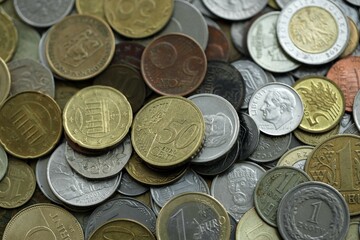 Big pile of different coins from various currencies and different countries around the world. Currency exchange