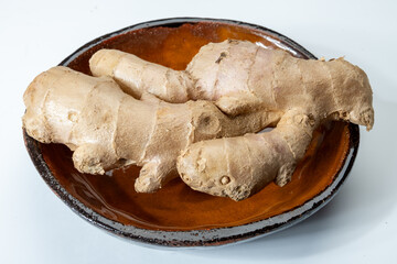 Fresh organic ginger rhizome root used in traditional medicines and for flavoring meals, drinks,...