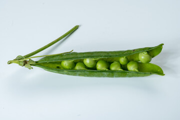 New harvest of fresh ripe green peas legumes