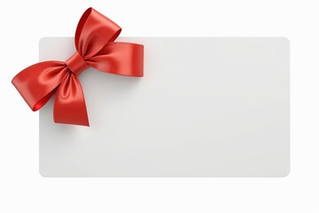 a close up of a white card with a red bow on it