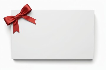 a close up of a white card with a red bow on it
