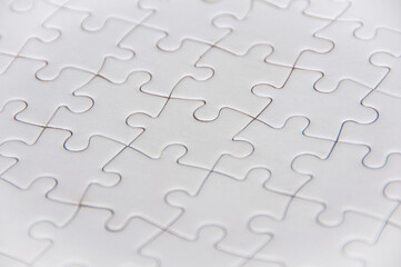 Fototapeta premium Side view of white jigsaw puzzle