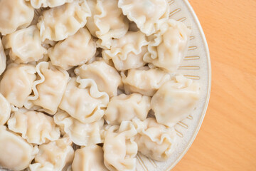Steaming Chinese meat dumplings on dinner table