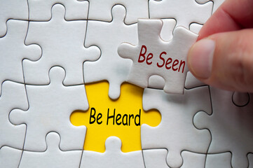 Be seen and Be Heard text on jigsaw puzzle. Marketing and business concept
