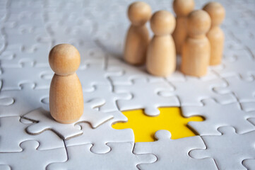 A wooden figure doll chosen to fill up vacancy position. Human resource hiring concept