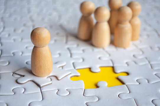 A wooden figure doll chosen to fill up vacancy position. Human resource hiring concept