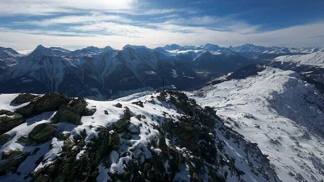 Drone Aerial View over the majestic Swiss Alps showcasing the grand alpine landscape with Matterhorn in the background in Aletsch Ski Resort, Switzerland. Amazing ski, snowboard destination.