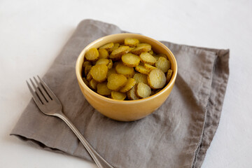 Organic Green Pickle Chips in a Bowl, side view.