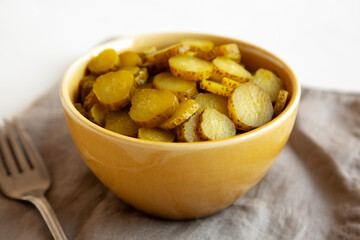 Organic Green Pickle Chips in a Bowl, side view.