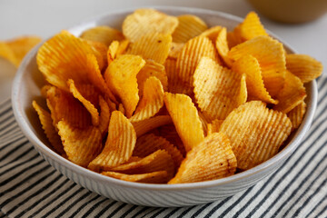 Crinkle Potato Chips in a Bowl, side view.