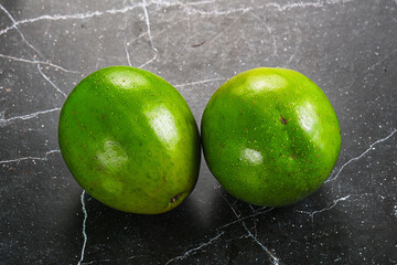 Two ripe green exotic avocado fruit