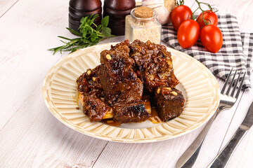 Prepared tasty beef ribs with sauce