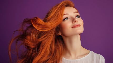 Naklejka premium Woman with long red hair is smiling and looking up. The image has a happy and positive mood
