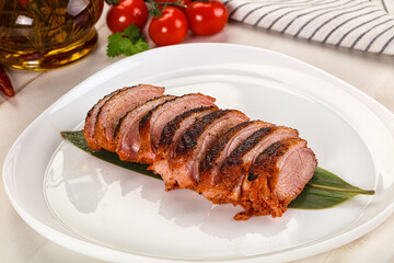 Sliced duck breast baked with cherry