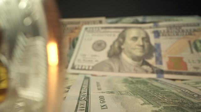 One hundred dollar bills and bitcoin. Earnings on cryptocurrency