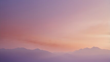 Obraz premium A serene and dreamy sunset over a calm body of water, with soft pastel hues of pink, purple, and orange painting the sky.