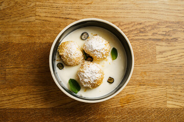Fried cottage cheese dumplings with vanilla sauce