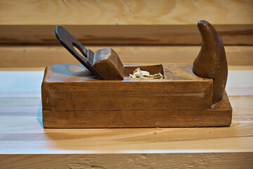 Old wooden hand plane for woodworking.