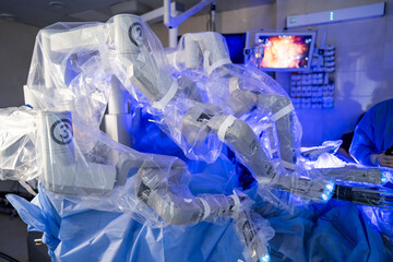 Advanced surgical robot in use. An advanced surgical robot is set up in an operating room with...