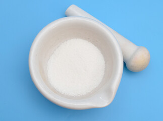 Alkylbenzene sulfonates powder on blue background