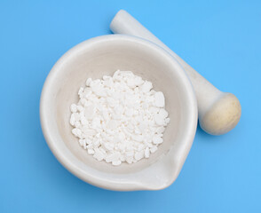 Calcium chloride on blue background