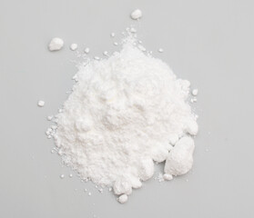 Caffeine powder on the light gray background