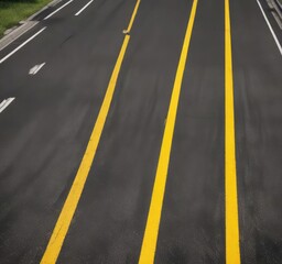 Top down shot of straight road with yellow paint lines, directional indicator, transportation industry, road closure
