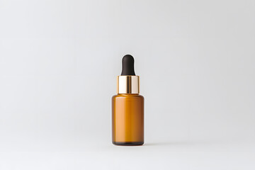 Amber bottle with dropper.  Minimalistic and modern design. Perfect for beauty products, essential oils or liquid medicines. Clean white background.