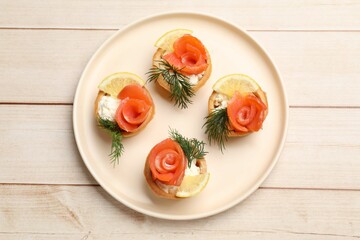 Tasty tartlets with delicious filling on wooden table, top view