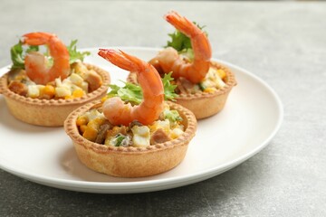 Tartlets with delicious filling on grey table, closeup