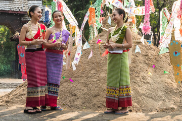 Beautiful Thai women in colorful traditional Thai clothing enjoy Song kran festival in Chiangmai together