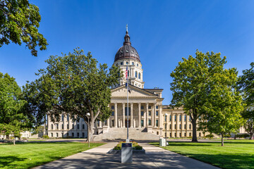 Kansas State Capitol, in Topeka on a sunny day. The Kansas State Capitol is the building housing the executive and legislative branches of government for the U.S. state of Kansas