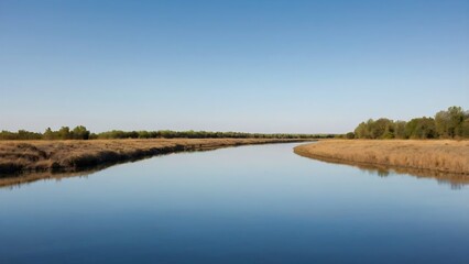 Smooth River Reflecting a Blue Sky