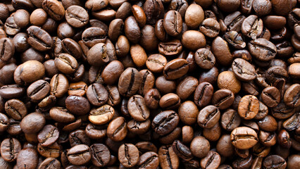 Roasted coffee background, texture, top view. Top view of coffee beans, background, texture. Coffee beans as a background for packaging use.